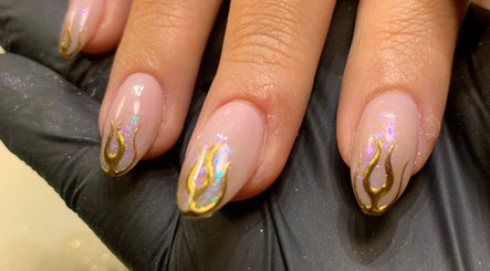 Elegant gold flame nail art at Nail Tech Bec in None, England, GB. Perfect for stylish designs.