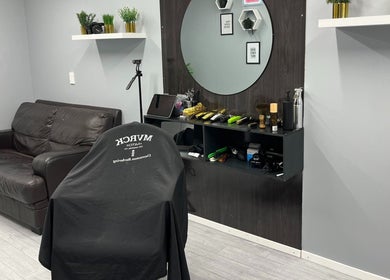 Stylish interior of LH Barbershop, Paraparaumu, Wellington, NZ, featuring modern decor and comfortable seating.