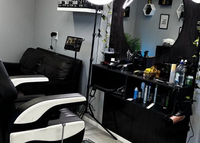 Sophisticated barber setup at LH Barbershop in Paraparaumu, Wellington, NZ with modern chairs and grooming tools.