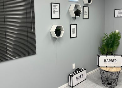 Sleek interior of LH Barbershop in Paraparaumu, Wellington, NZ with stylish decor and barbering kits.