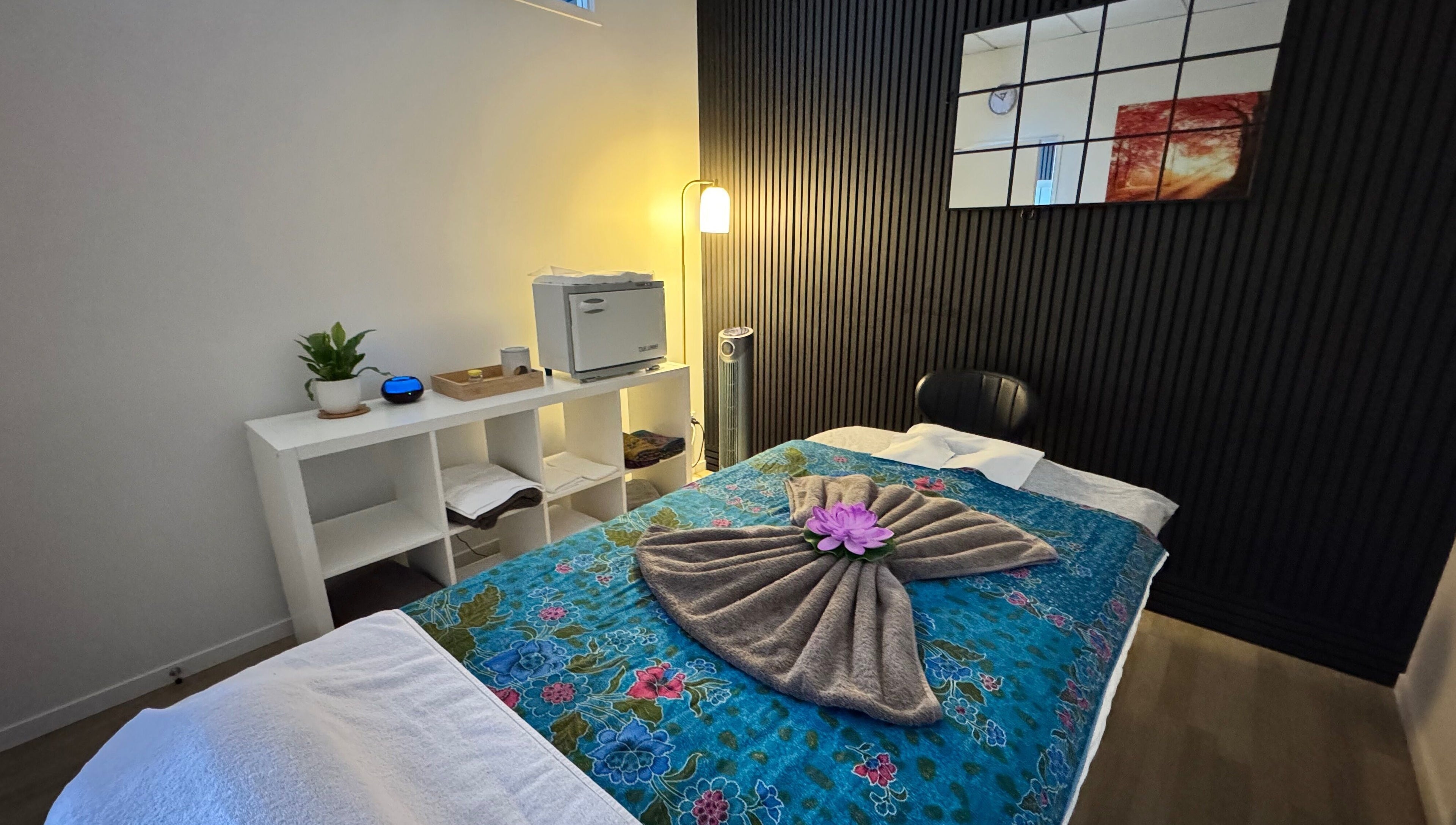 Tranquil massage room at Massage Loft (Pukekohe), Pukekohe, Auckland, NZ with a beautifully decorated massage bed.