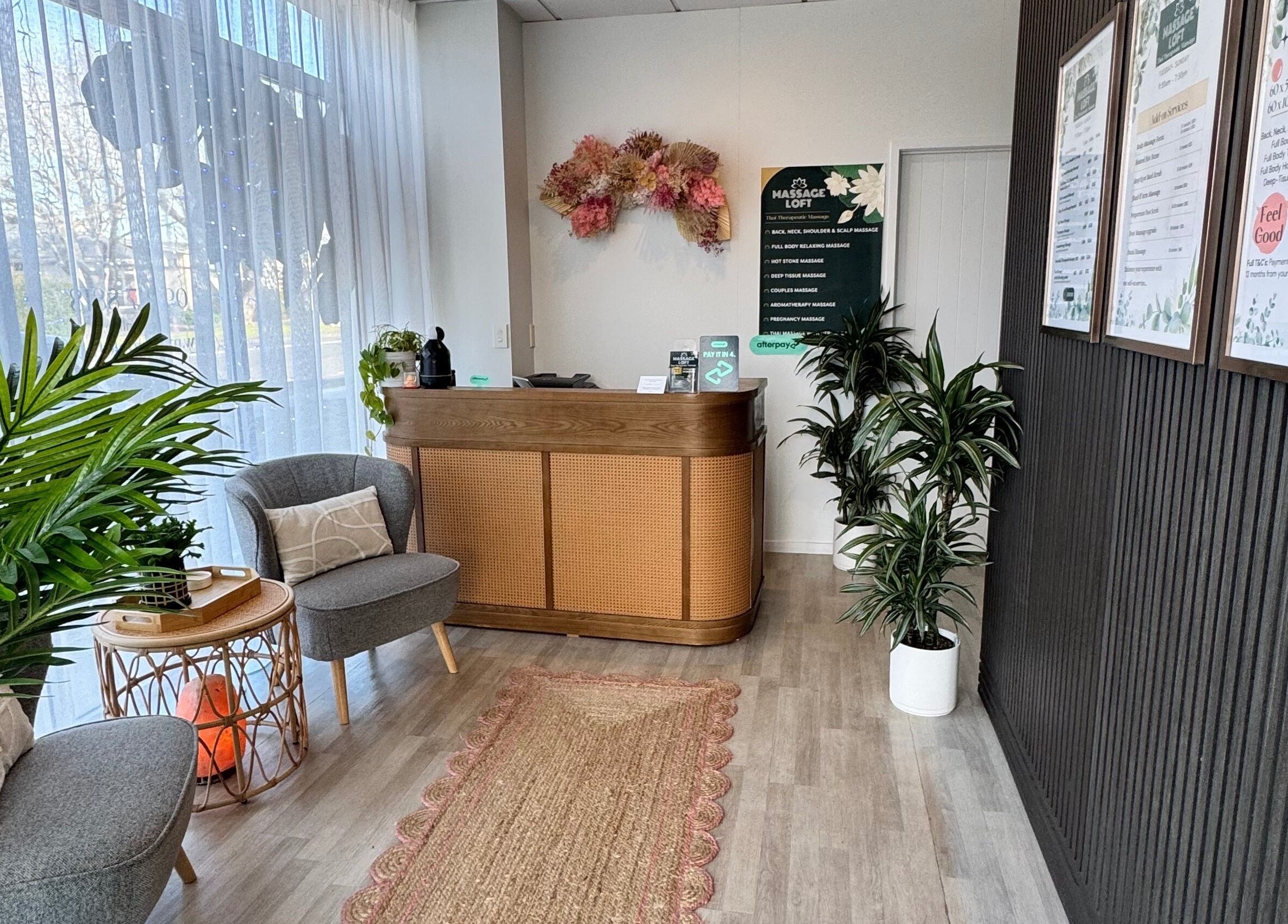 Welcoming reception area at Massage Loft (Pukekohe), Pukekohe, Auckland, NZ with cozy seating and greenery.