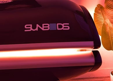 Sunbed at The Collarium Cult, Murarrie, Queensland, AU, offering a warm ambiance with vibrant lighting.