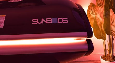 Sunbed at The Collarium Cult, Murarrie, Queensland, AU, offering a warm ambiance with vibrant lighting.