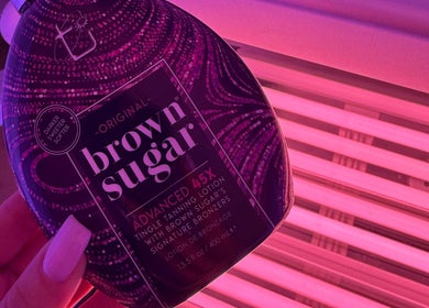 Bottle of Brown Sugar tanning lotion near tanning bed at The Collarium Cult, Murarrie, Queensland, AU.