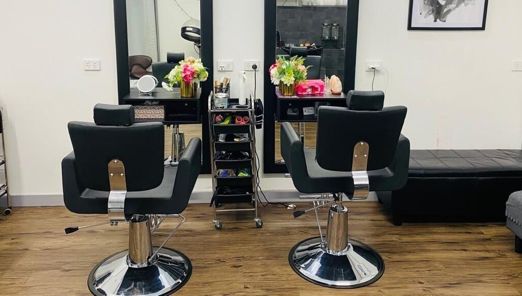 Modern salon interior of Bollywood cuts n brows in Melbourne, Victoria, AU with elegant styling chairs.
