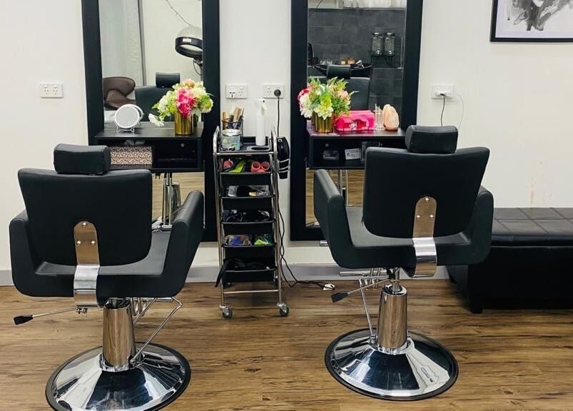 Modern salon interior of Bollywood cuts n brows in Melbourne, Victoria, AU with elegant styling chairs.