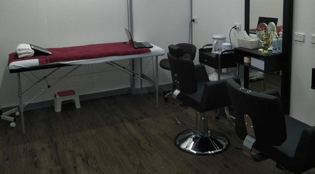 Chic treatment area at Bollywood cuts n brows in Melbourne, Victoria, AU with chairs and table.