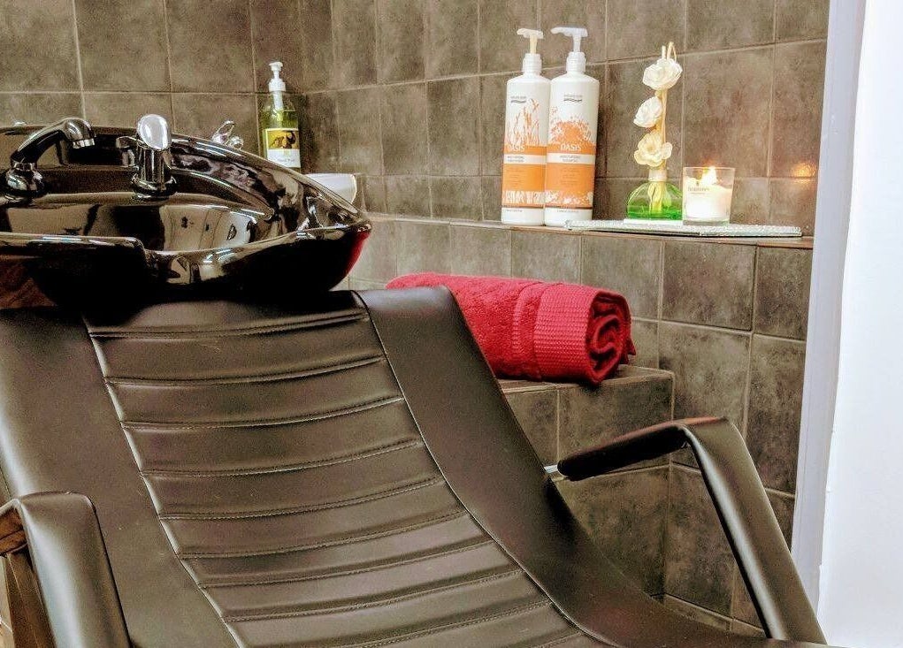 Luxurious wash station at Bollywood cuts n brows in Melbourne, Victoria, AU, featuring a reclining chair.