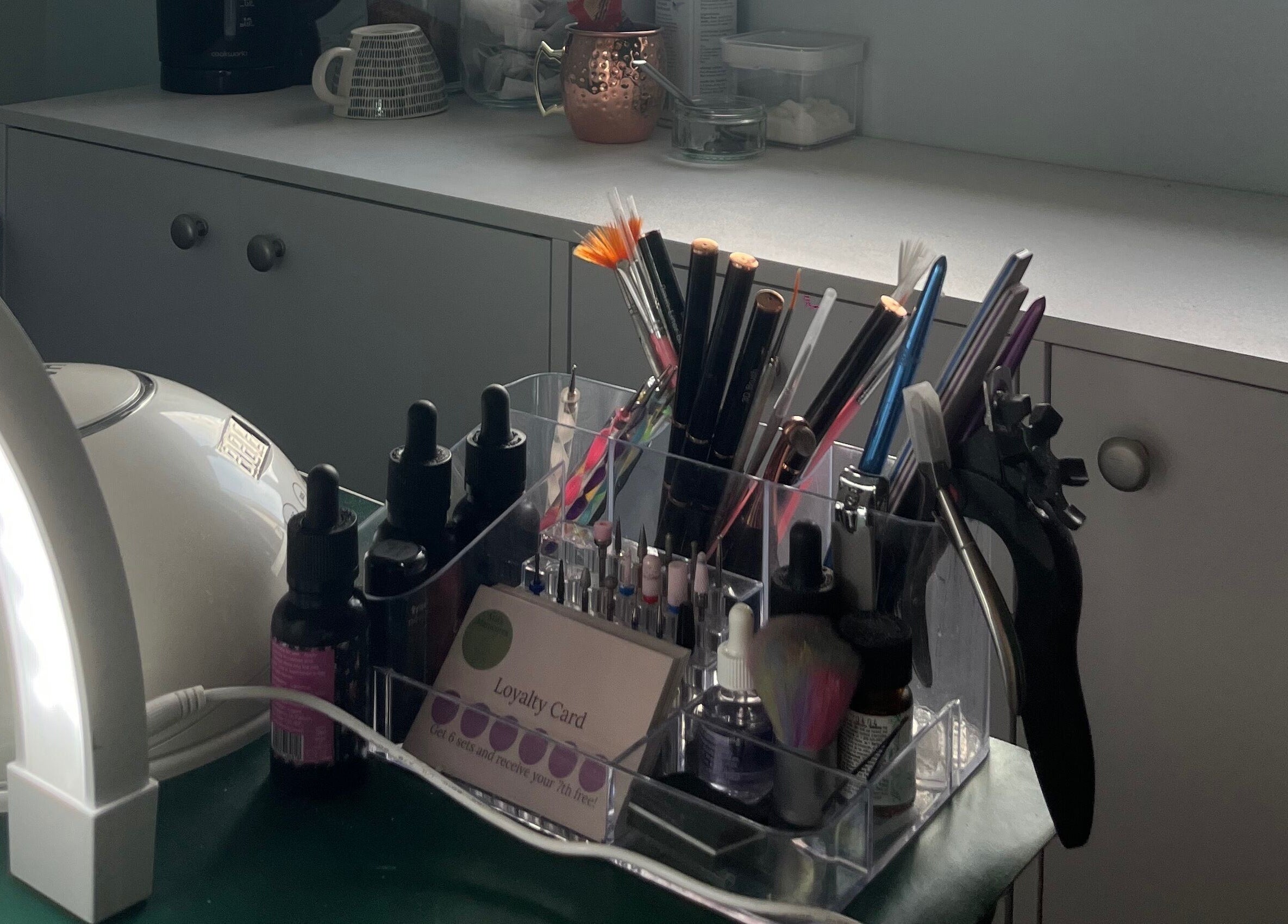 Mia's Manicures, Helston, England, GB. Stylish nail tools and products displayed neatly on a modern countertop.