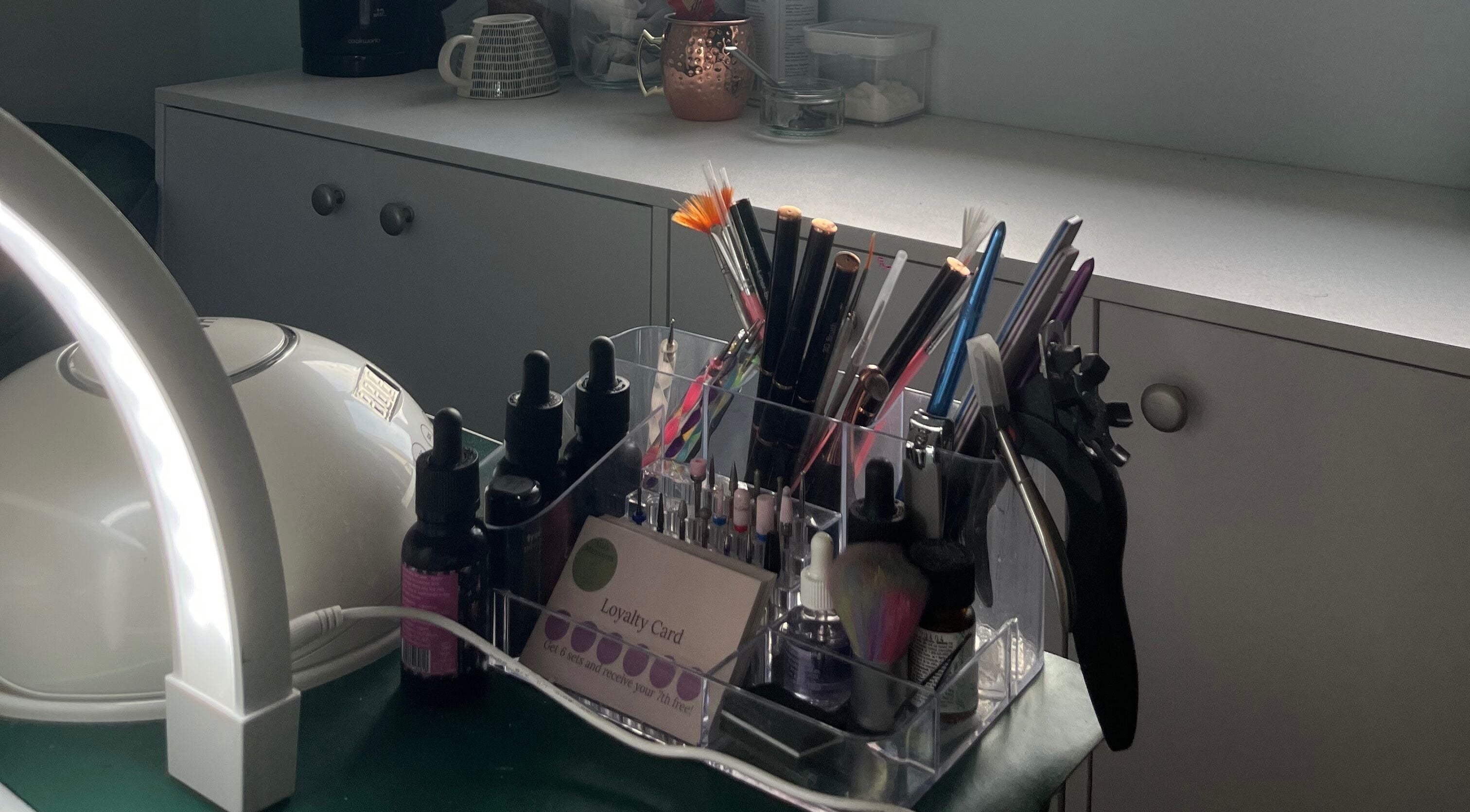 Mia's Manicures, Helston, England, GB. Stylish nail tools and products displayed neatly on a modern countertop.