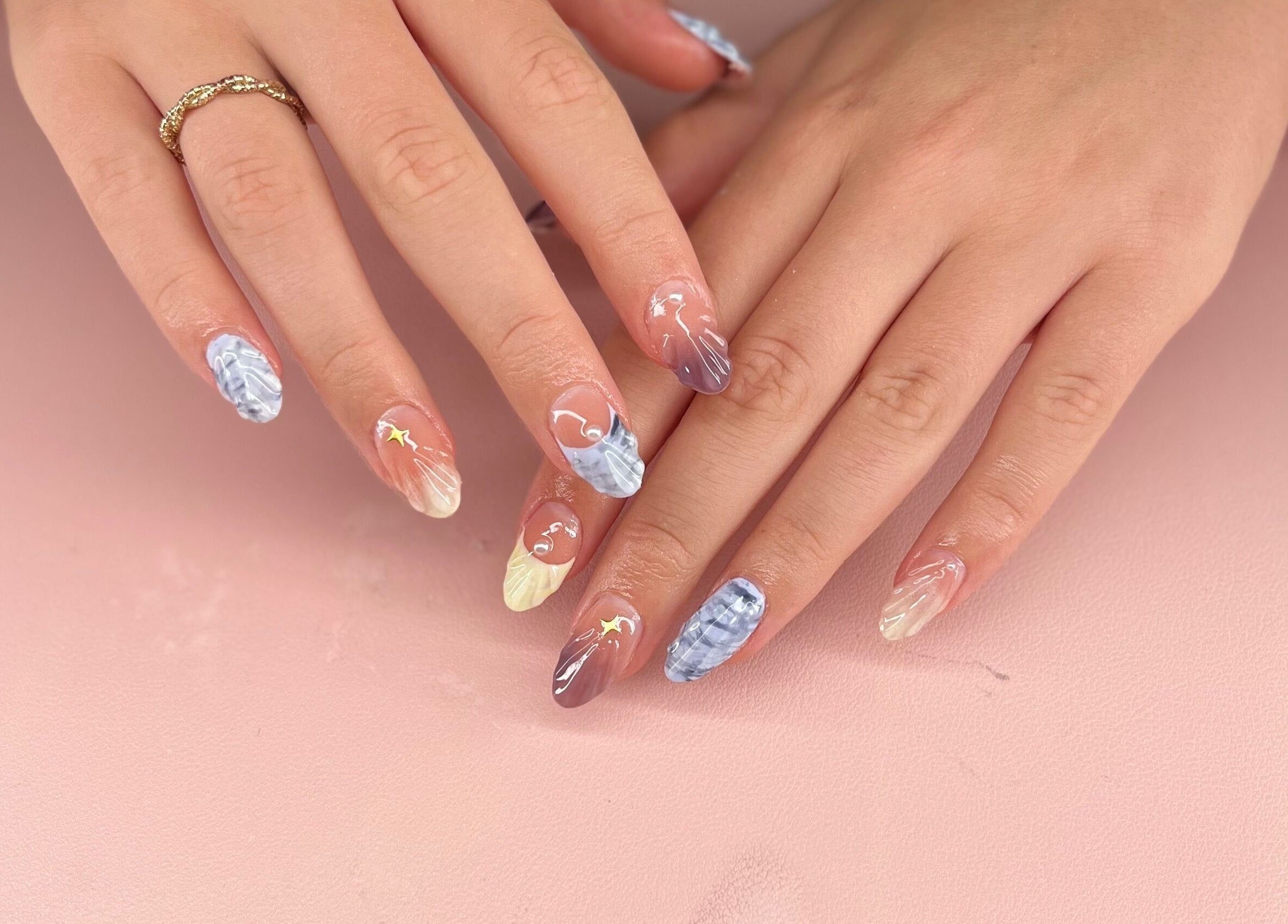 Stylish nail art at Mia's Manicures, Helston, England, GB featuring diverse colors and patterns.