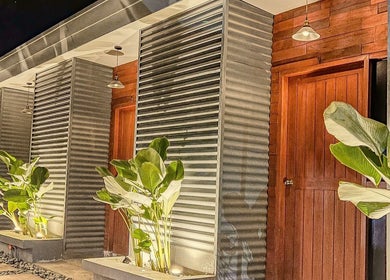 Modern exterior of Essa Spa & Nails in Lapu-lapu City, Central Visayas, PH, with illuminated plants.