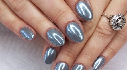 Shiny blue manicure at T-Royals Beauty, Cape Town, Western Cape, ZA.