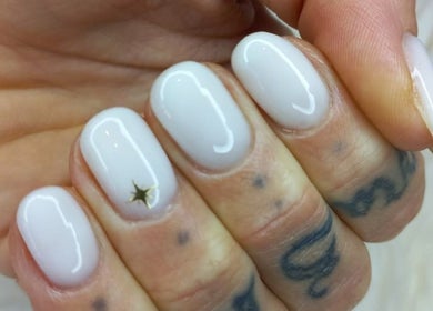 Elegant white nails with a gold star at T-Royals Beauty, Cape Town, Western Cape, ZA.