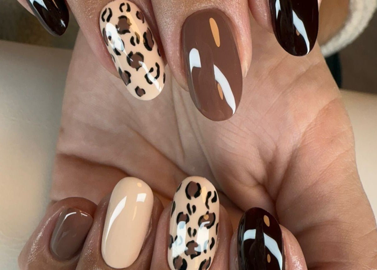 Stylish leopard print nails at BON ME LOUNGE, carrigtohill, County Cork, IE. Perfect blend of artistry and elegance.