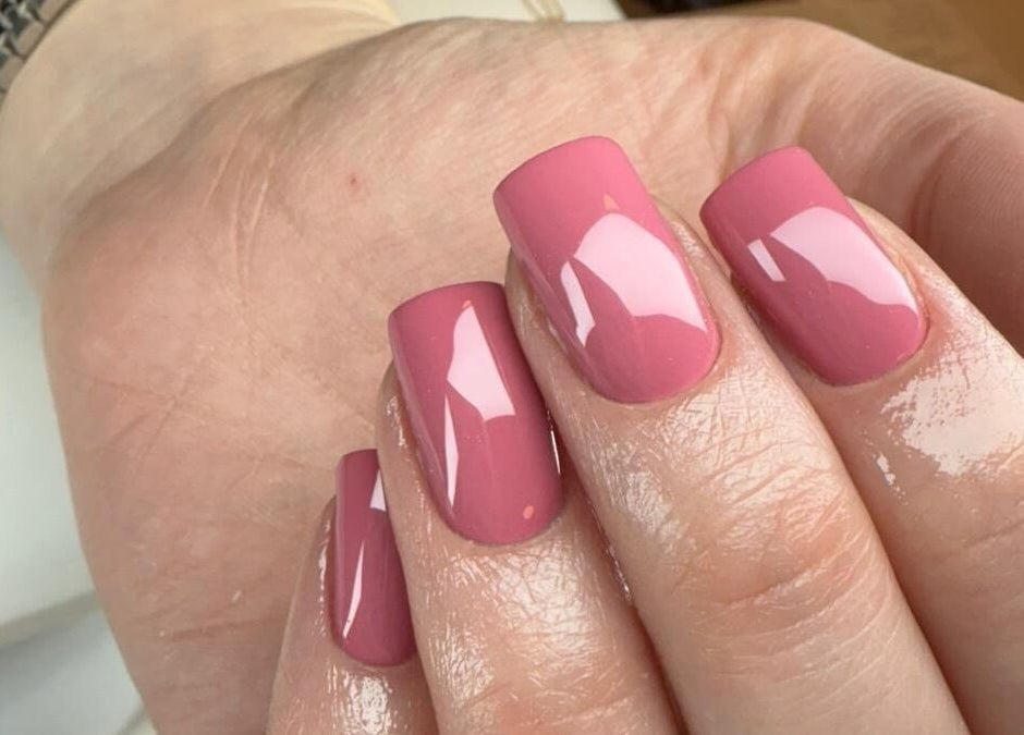 Pink glossy manicured nails at BON ME LOUNGE in carrigtohill, County Cork, IE.