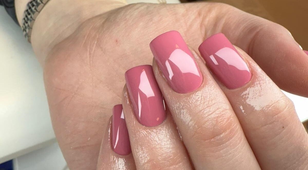 Pink glossy manicured nails at BON ME LOUNGE in carrigtohill, County Cork, IE.