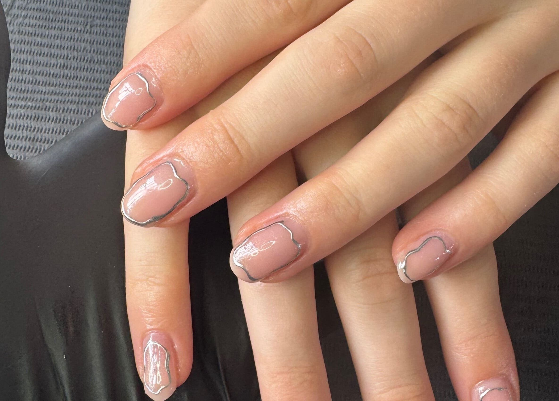Elegant nail art with silver accents at Beautitude, Clitheroe, England, GB.
