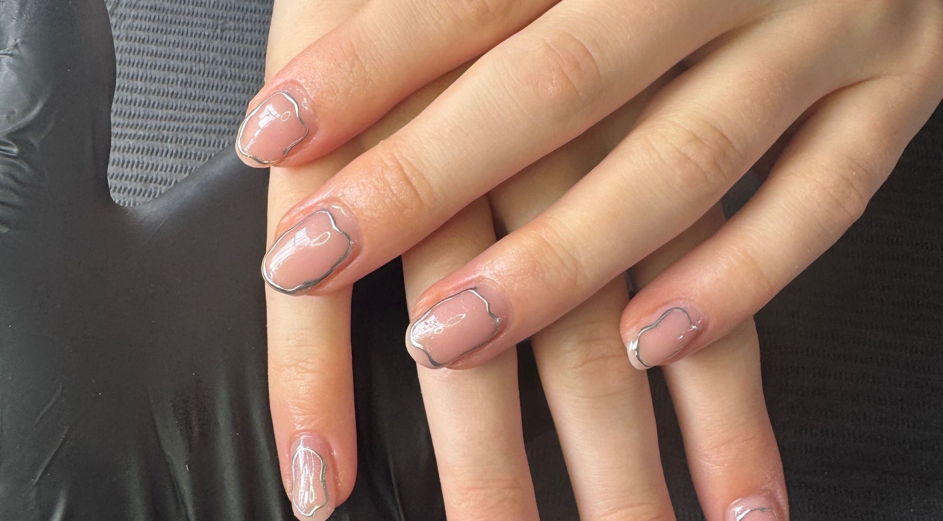 Elegant nail art with silver accents at Beautitude, Clitheroe, England, GB.