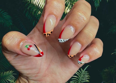 Vibrant cherry and animal print manicures at Beautitude in Clitheroe, England, GB.