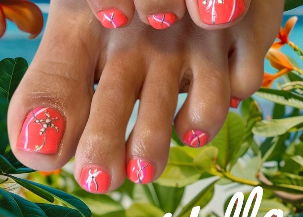 Bright coral toenail art at Beautitude in Clitheroe, England, GB with tropical foliage background.