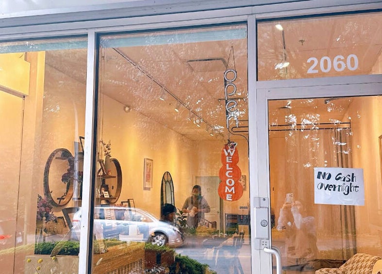 Entrance of Lunaria in Richmond, British Columbia, CA, showcasing a welcoming interior design through a glass door.