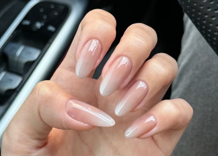 Beautifully manicured nails at Lunaria, Richmond, British Columbia, CA, showcasing delicate ombre design.