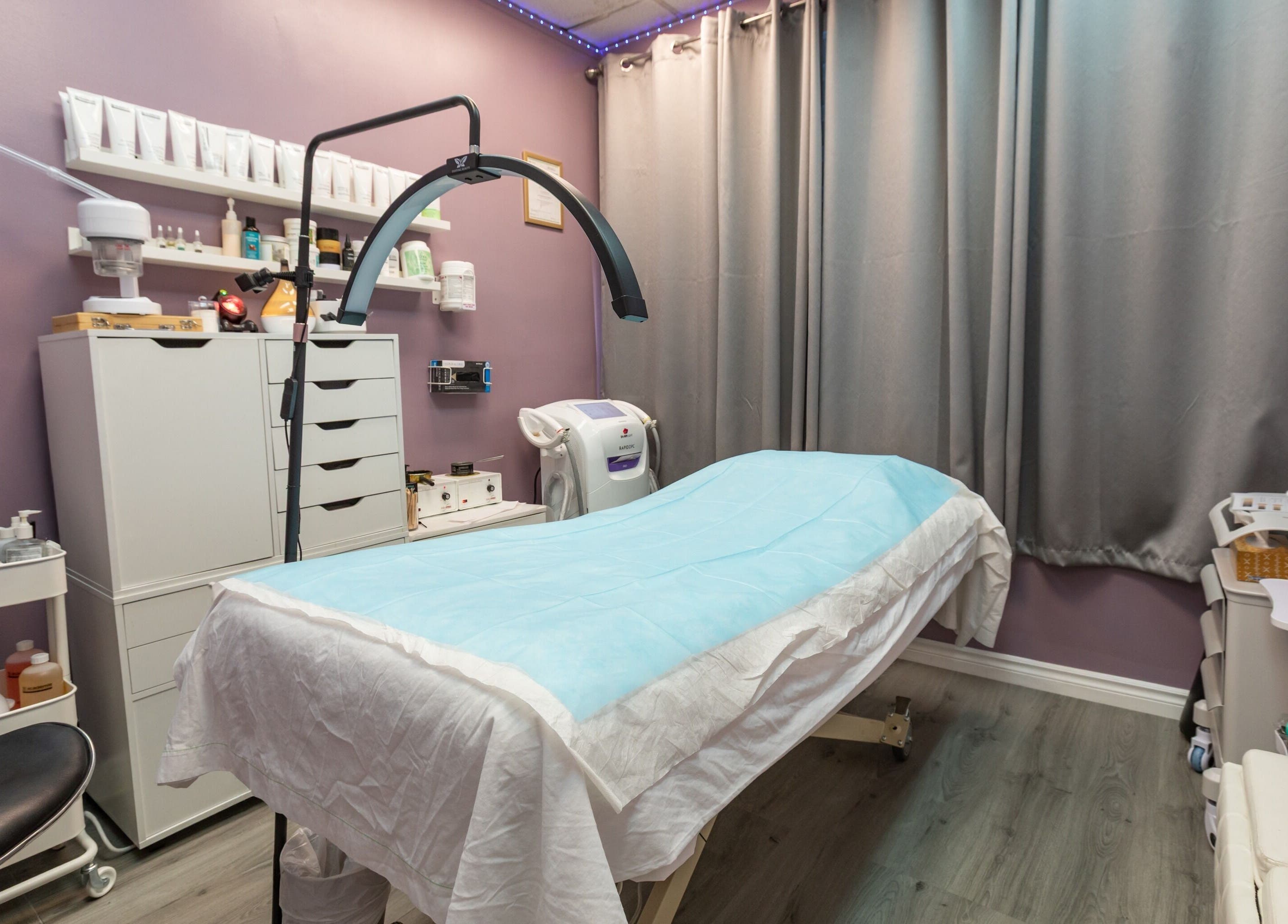 Calm treatment room at Alexandra Esthetique in Montréal west, Québec, CA, featuring modern equipment and products.