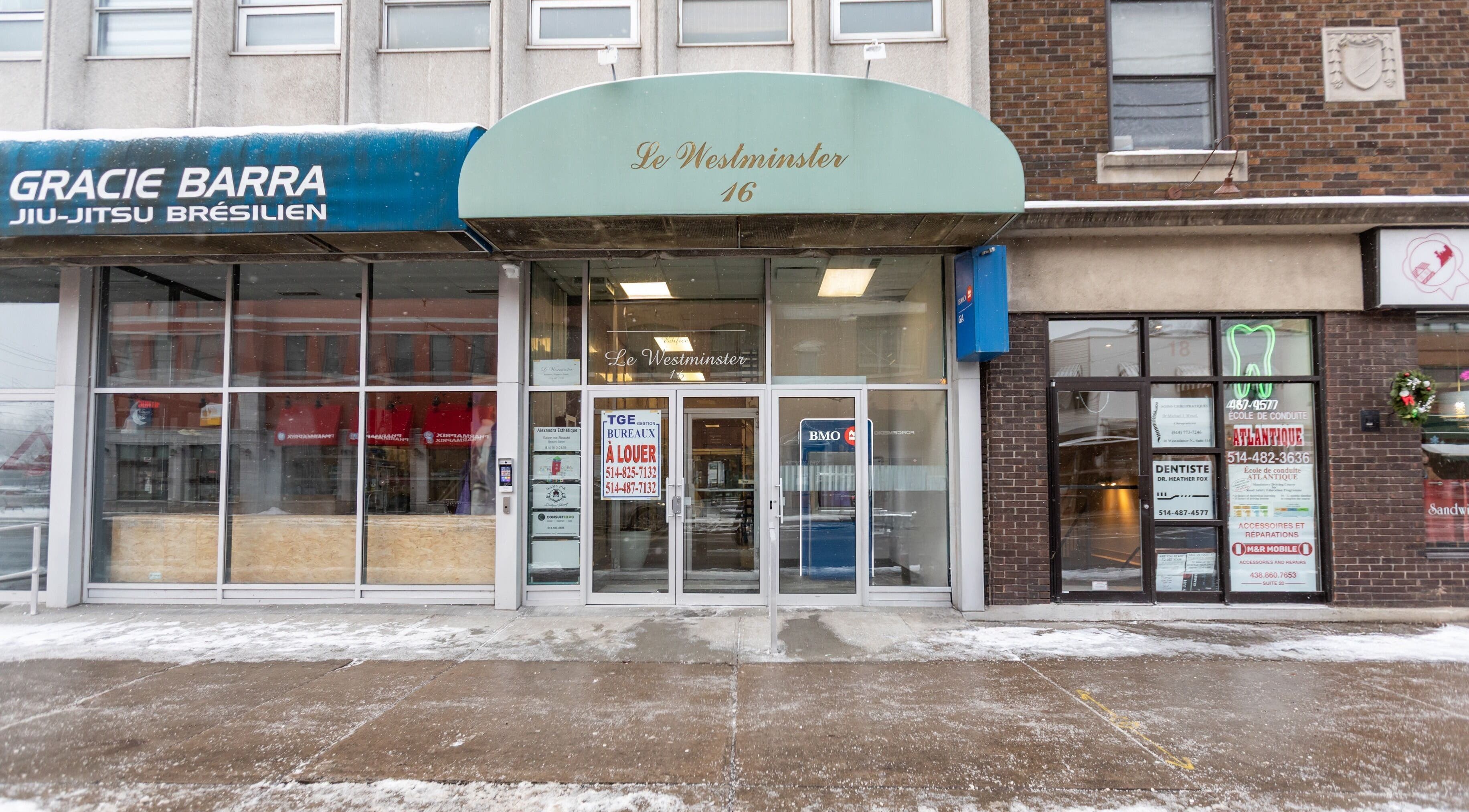 Front view of Alexandra Esthetique at Le Westminster, Montréal west, Québec, CA, showcasing glass entrance.