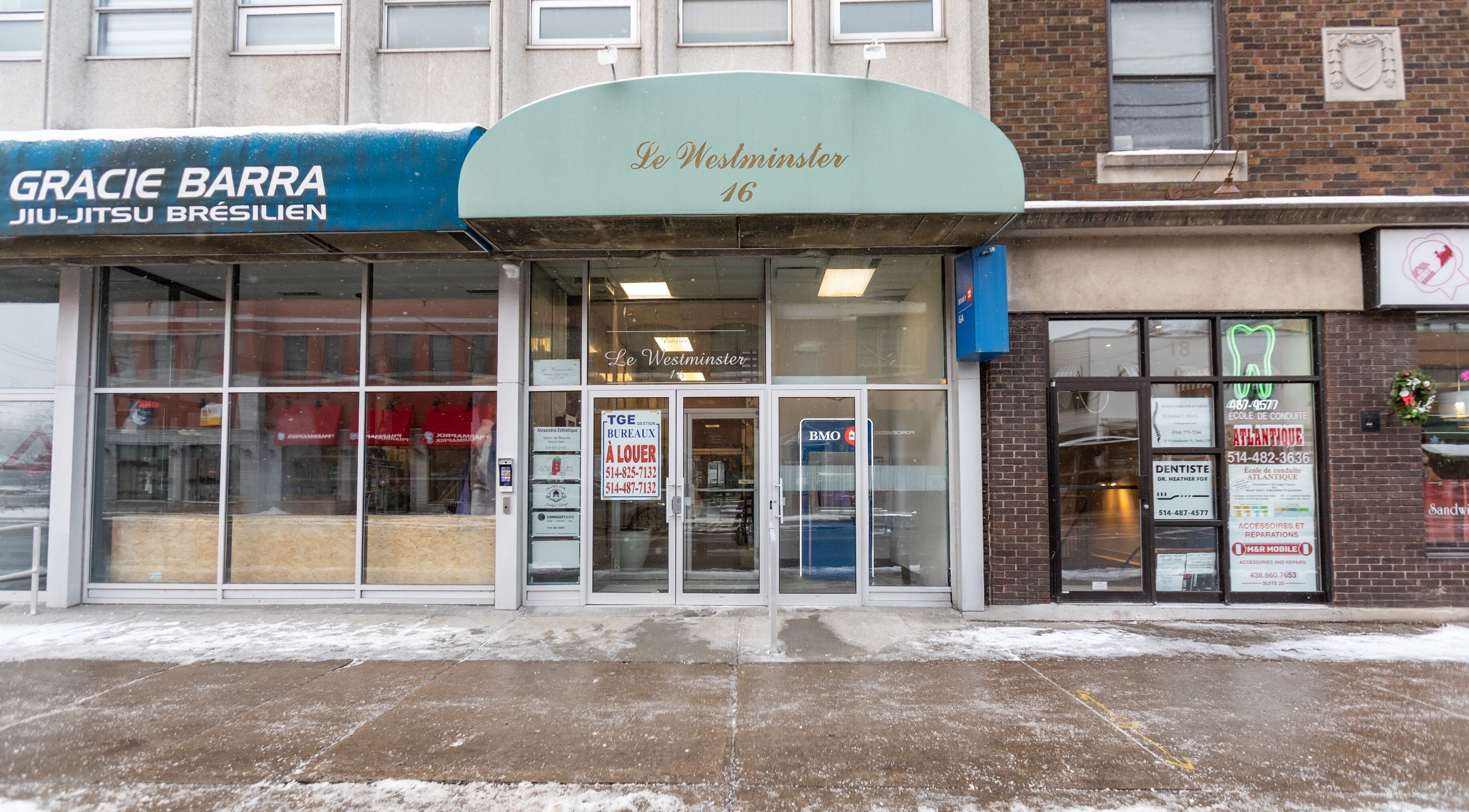 Front view of Alexandra Esthetique at Le Westminster, Montréal west, Québec, CA, showcasing glass entrance.
