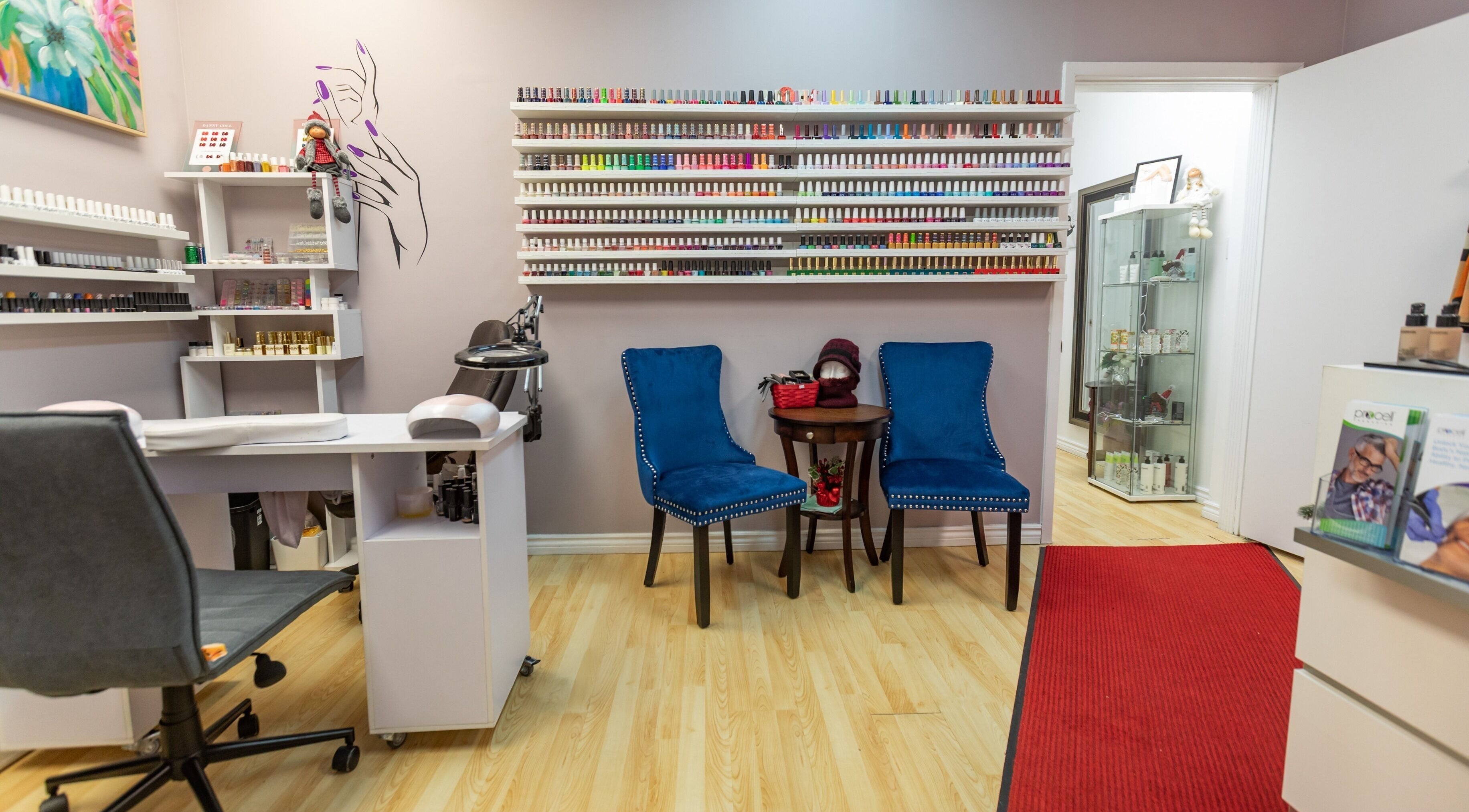 Nail care area at Alexandra Esthetique, a beauty venue in Montréal west, Québec, CA, featuring vibrant polish selection.