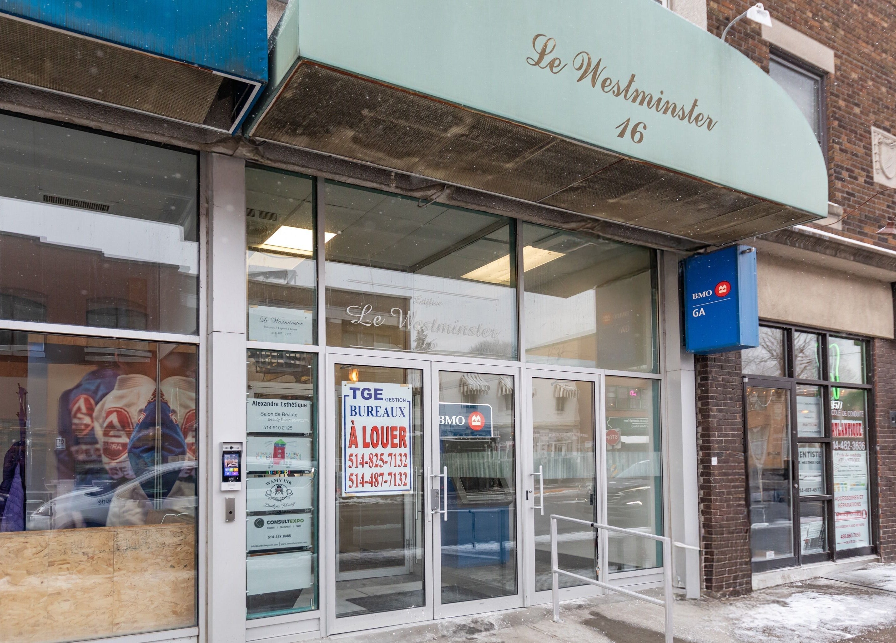 Entrance of Alexandra Esthetique at Montréal west, Québec, CA, showcasing modern glass doors.