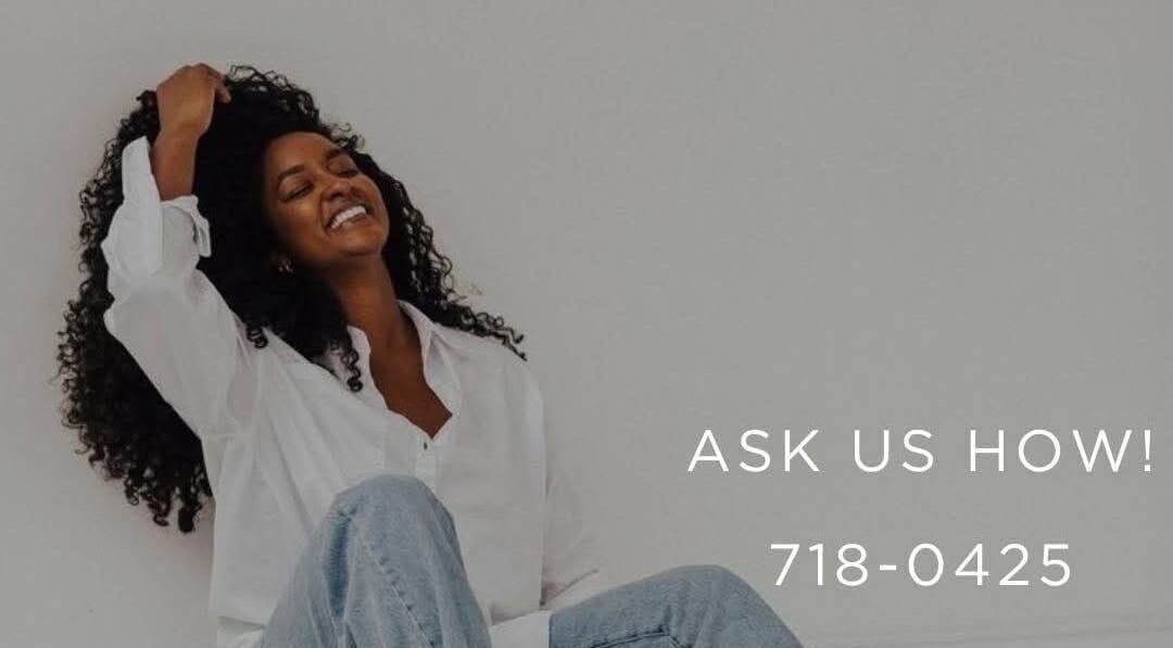 Smiling woman in a white shirt at Ladyboss Medical Spa, Freeport, Couva-tabaquite-talparo Regional Corporation, TT