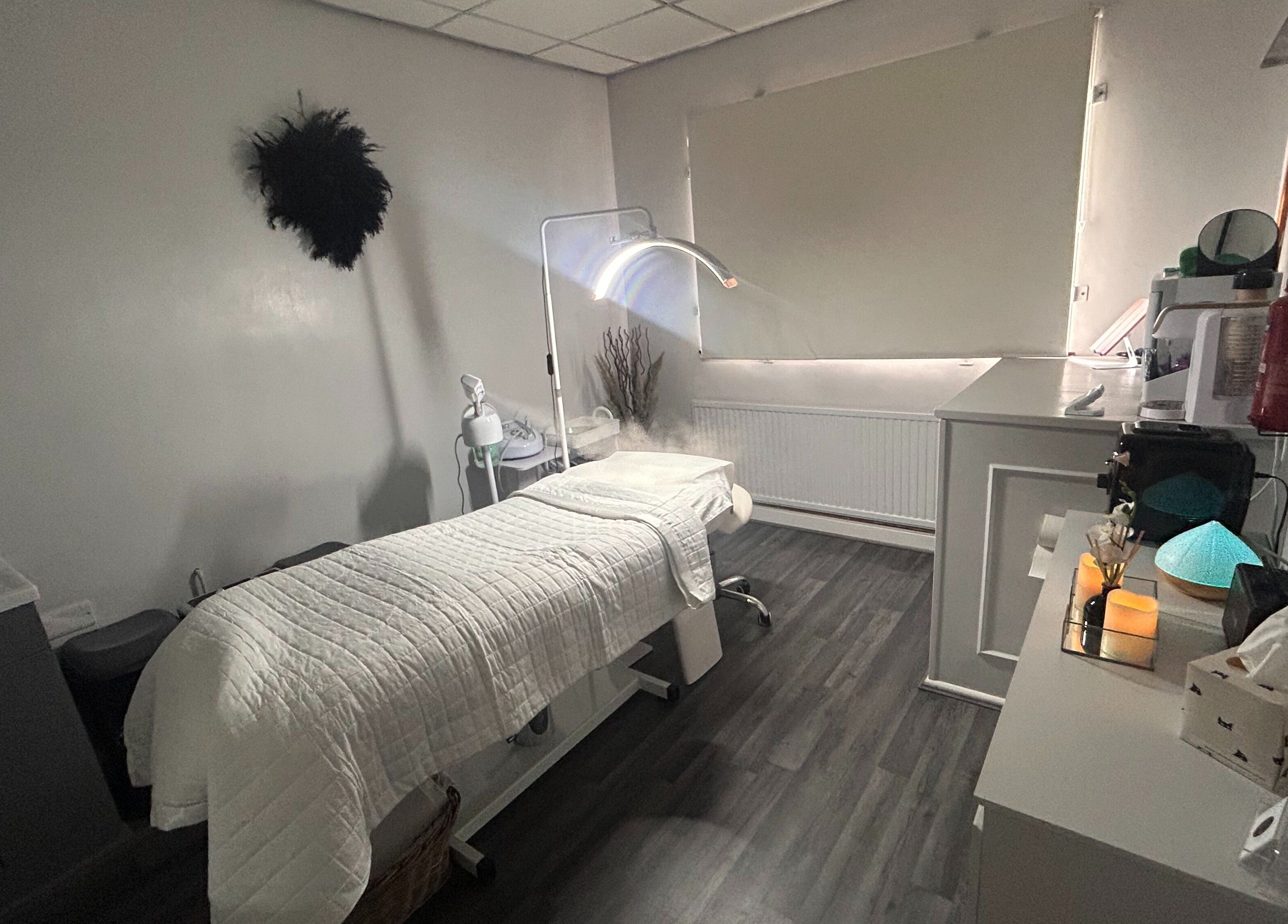 Cozy therapy room at Sculpt & Define Studio, Pencader, Wales, GB with a treatment table and soothing decor.