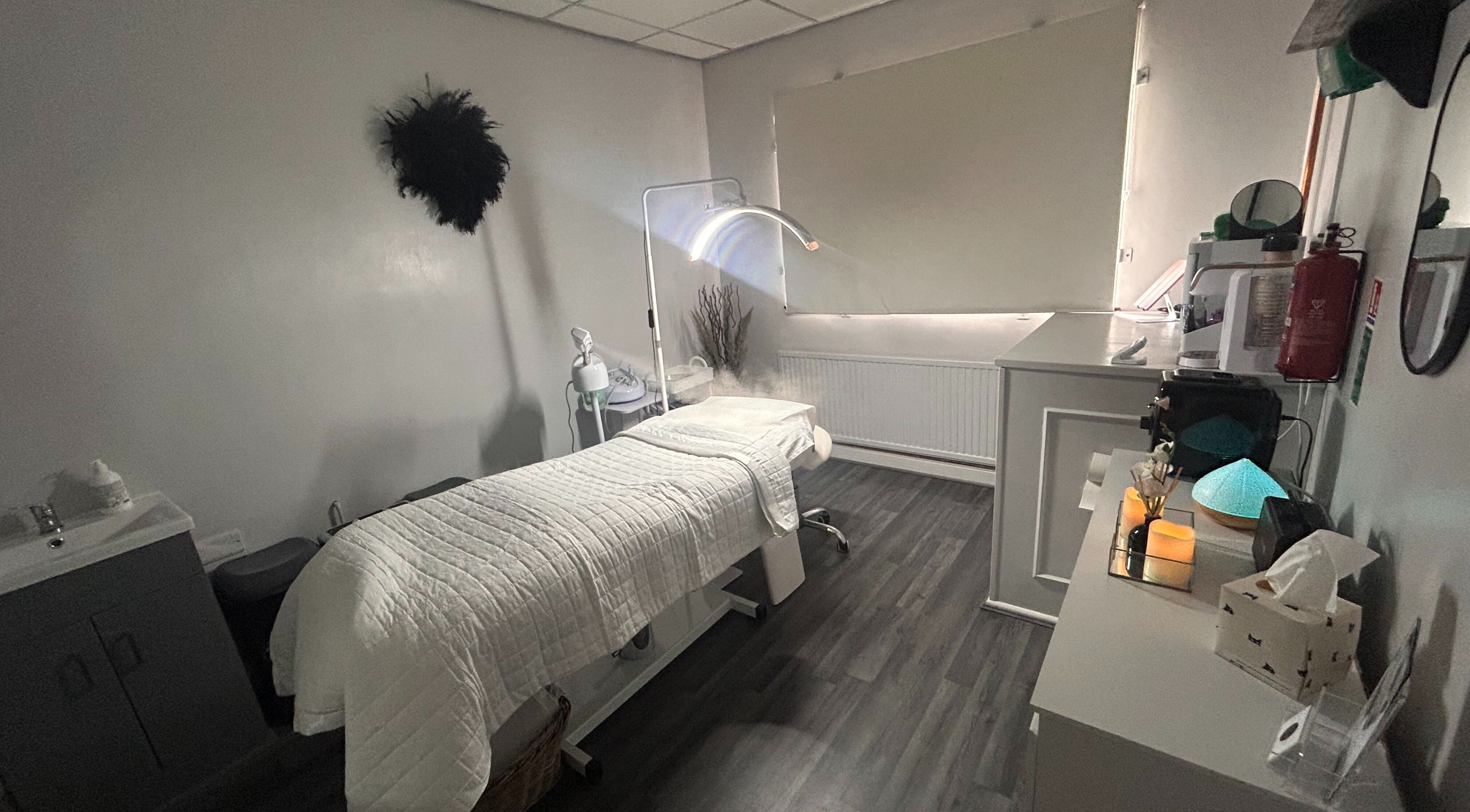 Cozy therapy room at Sculpt & Define Studio, Pencader, Wales, GB with a treatment table and soothing decor.