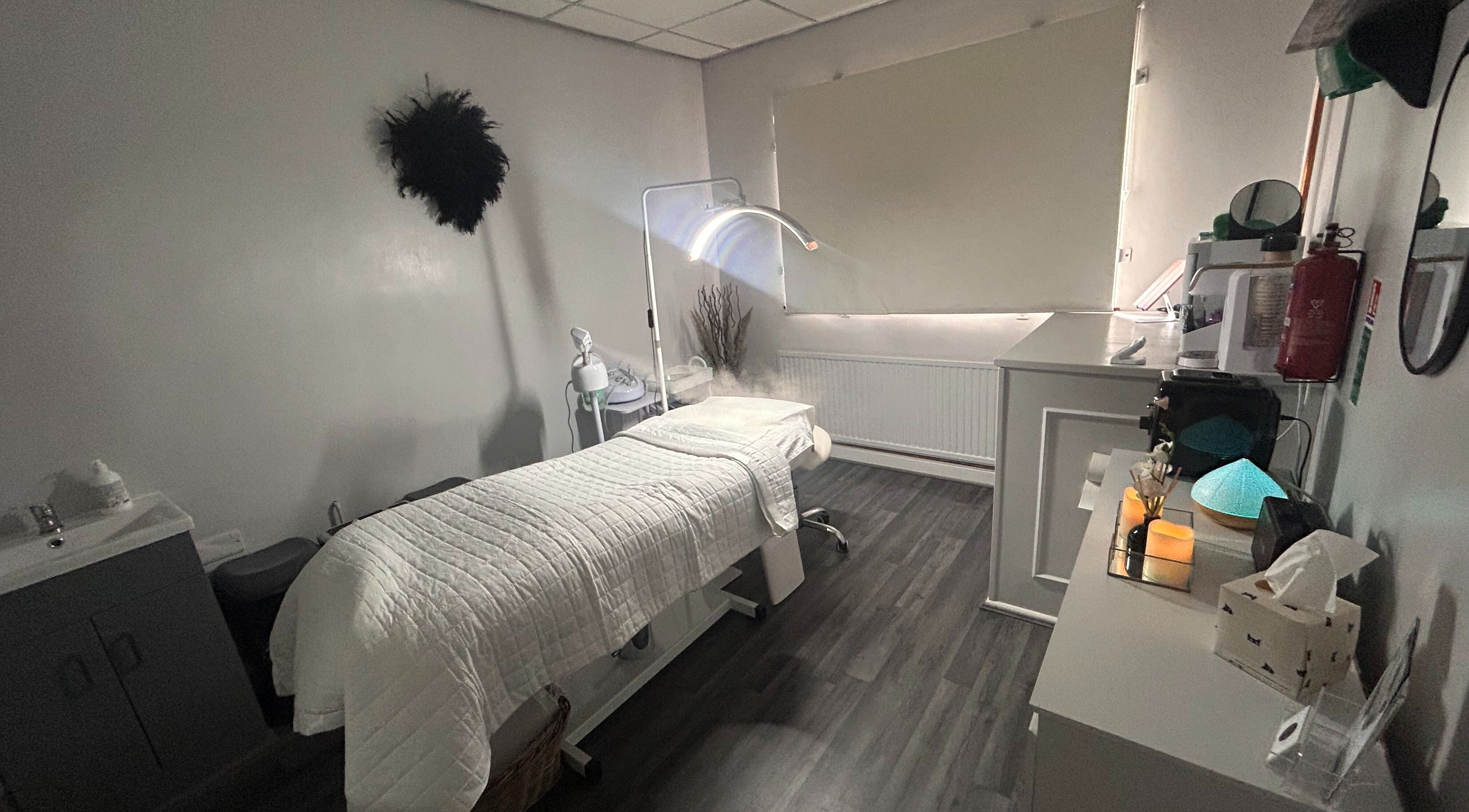 Cozy therapy room at Sculpt & Define Studio, Pencader, Wales, GB with a treatment table and soothing decor.