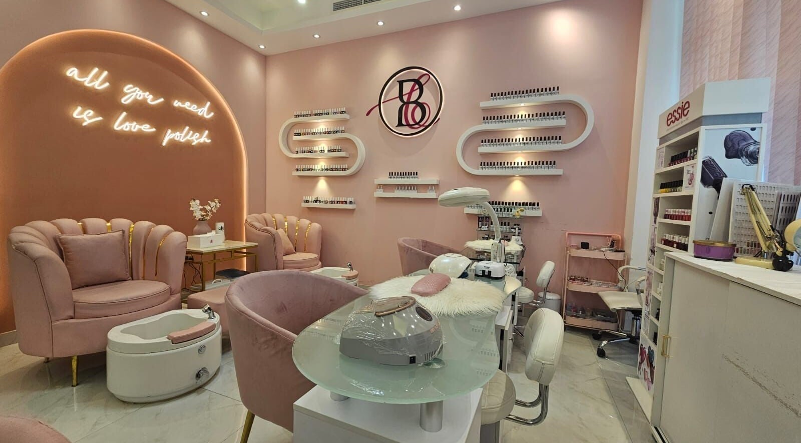 Beauty Blender Salon's chic interior in Dubai, AE with luxurious pink decor and stylish nail stations.