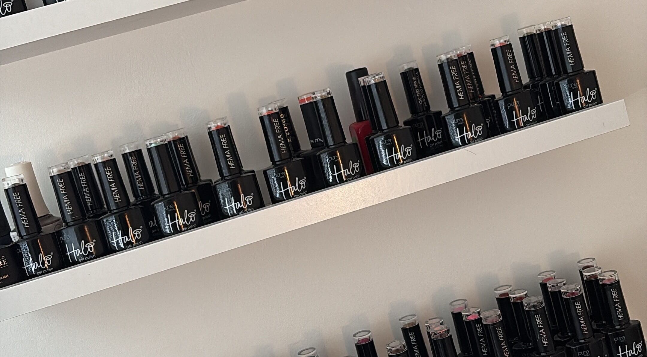 Elegant nail polish bottles on display at Beauty Hub, Peterborough, England, GB, showcasing variety.