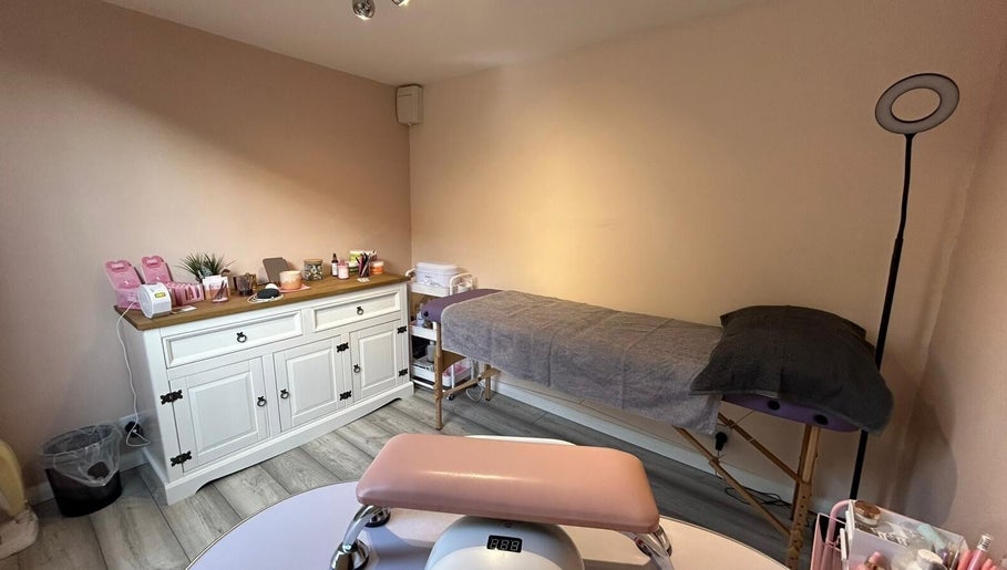 Tranquil treatment room at Emma's Place, Haverhill, England, GB, featuring a massage table and organized supplies.