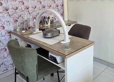 Stylish manicure station at Daniella Nail Studio in Randburg, Gauteng, ZA with floral walls and modern decor.