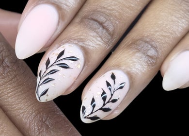 Elegant black floral nail art at Daniella Nail Studio, Randburg, Gauteng, ZA. Perfect for stylish manicures.
