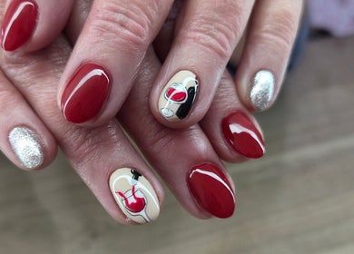Elegant red nails with wine glass art at Daniella Nail Studio, Randburg, Gauteng, ZA.
