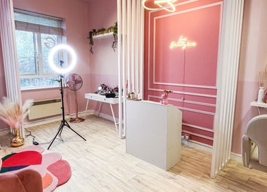 Elegant pink interior of Lyn Beauty & Co. in Dublin, County Dublin, IE featuring stylish decor and lighting.