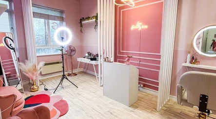 Elegant pink interior of Lyn Beauty & Co. in Dublin, County Dublin, IE featuring stylish decor and lighting.