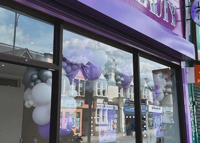 Front view of LAB Hair Lashes salon in Welling, England, GB, showcasing a purple-themed exterior design.