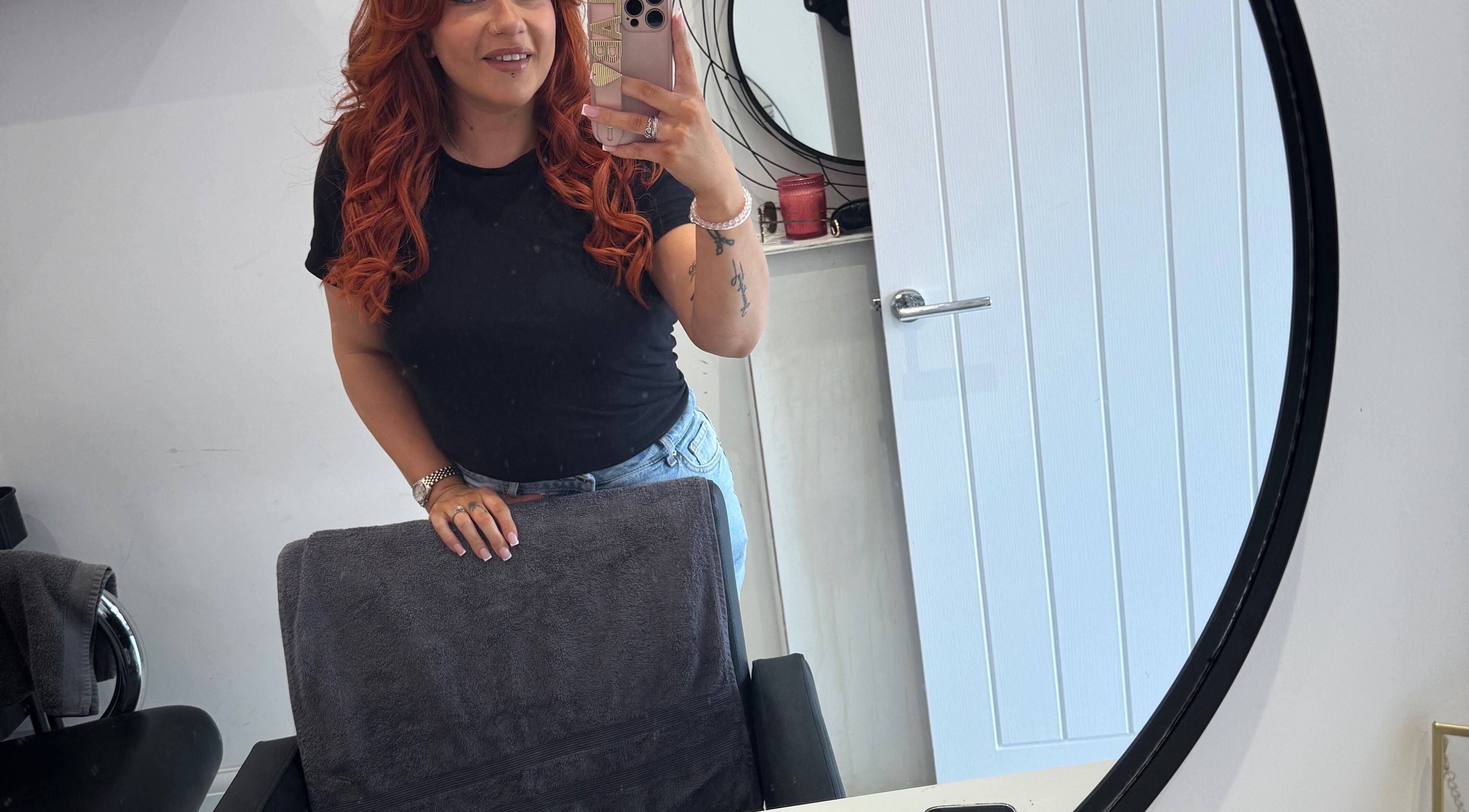 Professional stylist at LAB Hair Lashes in Welling, England, GB, taking a mirror selfie at salon.