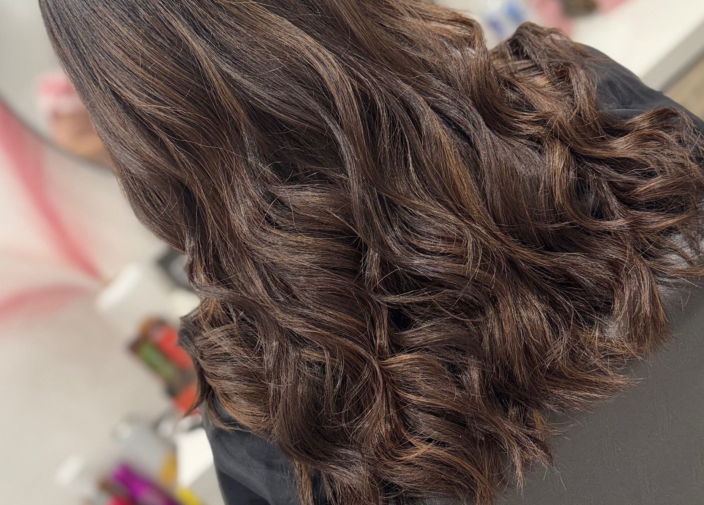 Elegant wavy hair styling at LAB Hair Lashes, Welling, England, GB, showcasing a voluminous look.