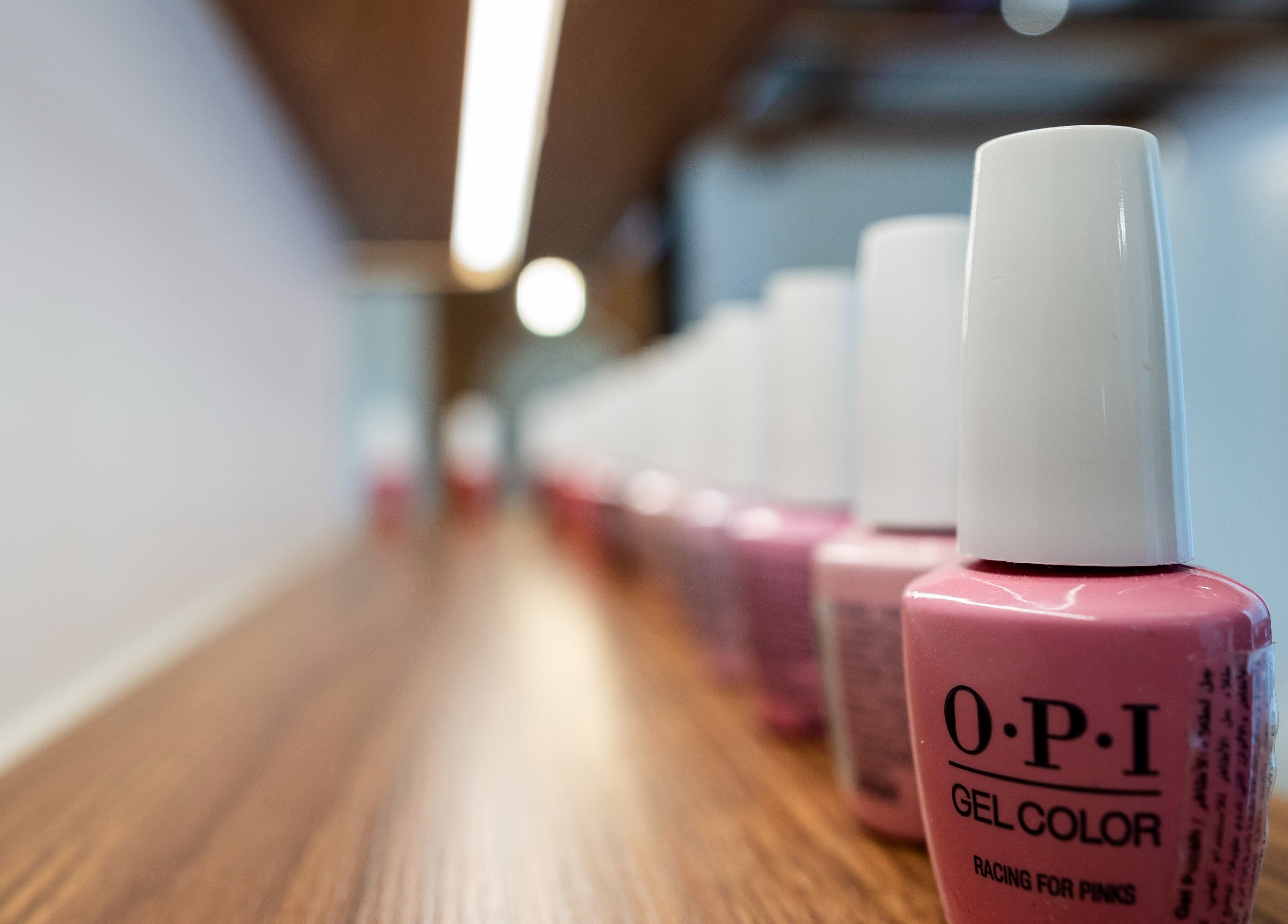 Pink nail polish bottles at Noluci Spa, الرياض, SA for a stylish manicure experience.