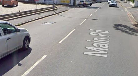 Street view near Wellue Beauty, Paarl, Western Cape, ZA. Cars parked along Main Rd.